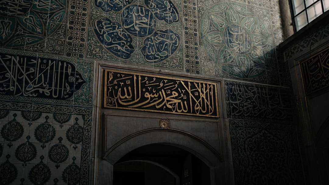 Marble mosaic wall with intricate calligraphy inlay
